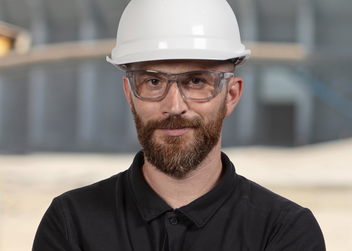 Utility worker wearing protective prescription safety glasses
