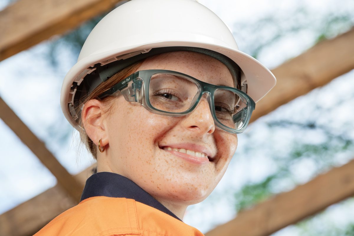 Agricultural worker wearing ugly fish dozer ocean green prescription safety glasses