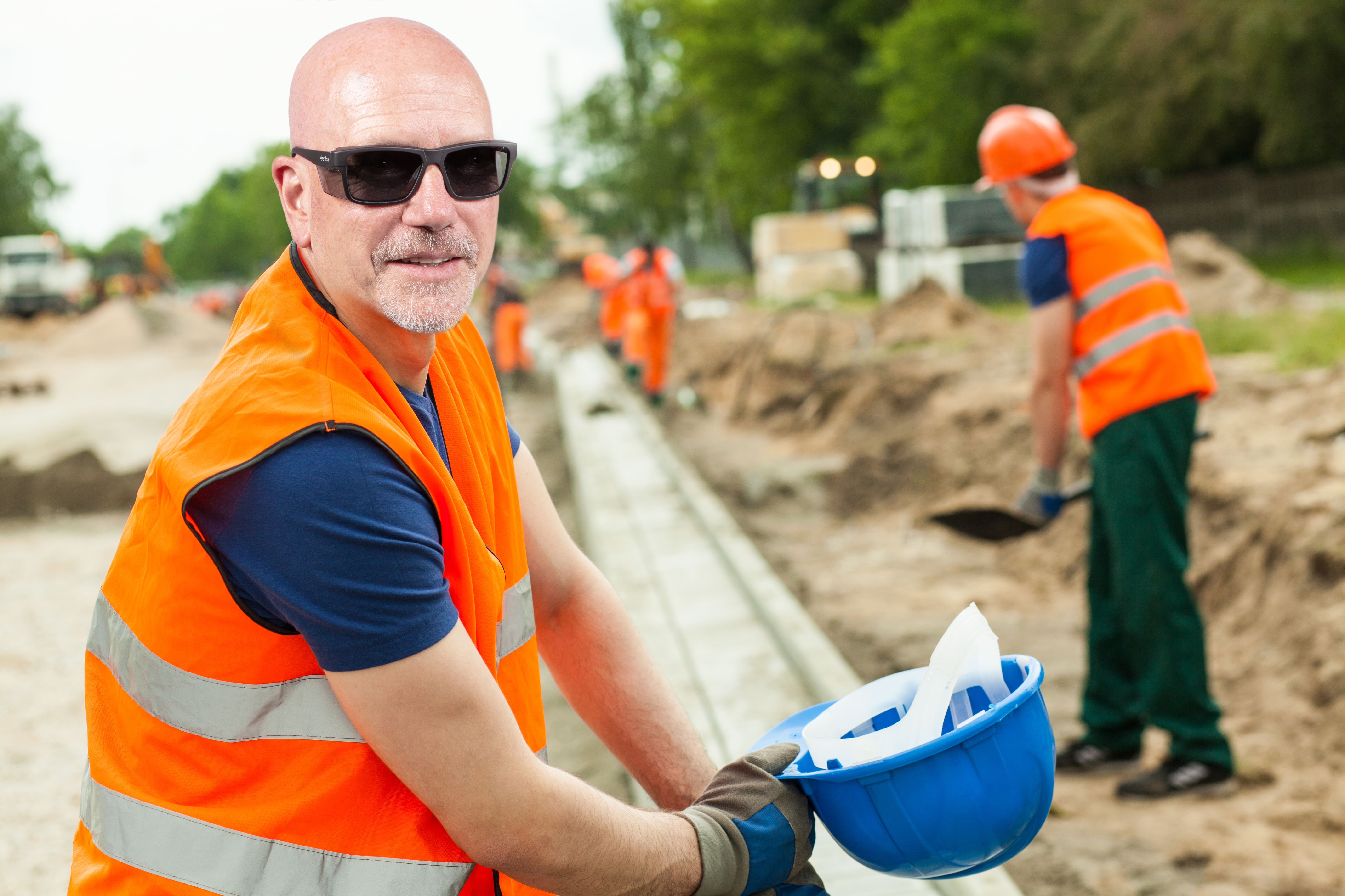 Construction worker wearing protective prescription safety glasses