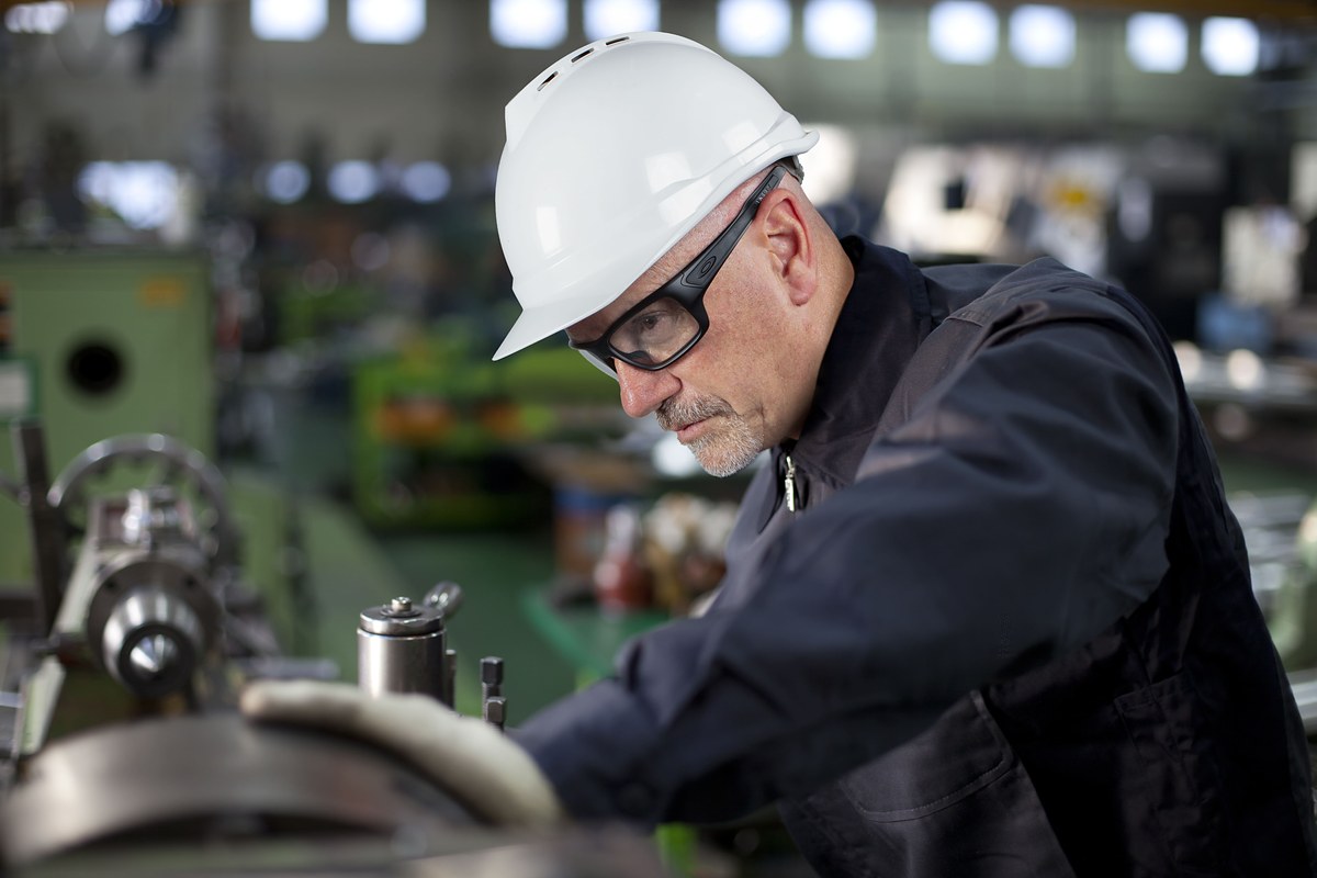 Worker wearing oakley turbine black prescription safety glasses