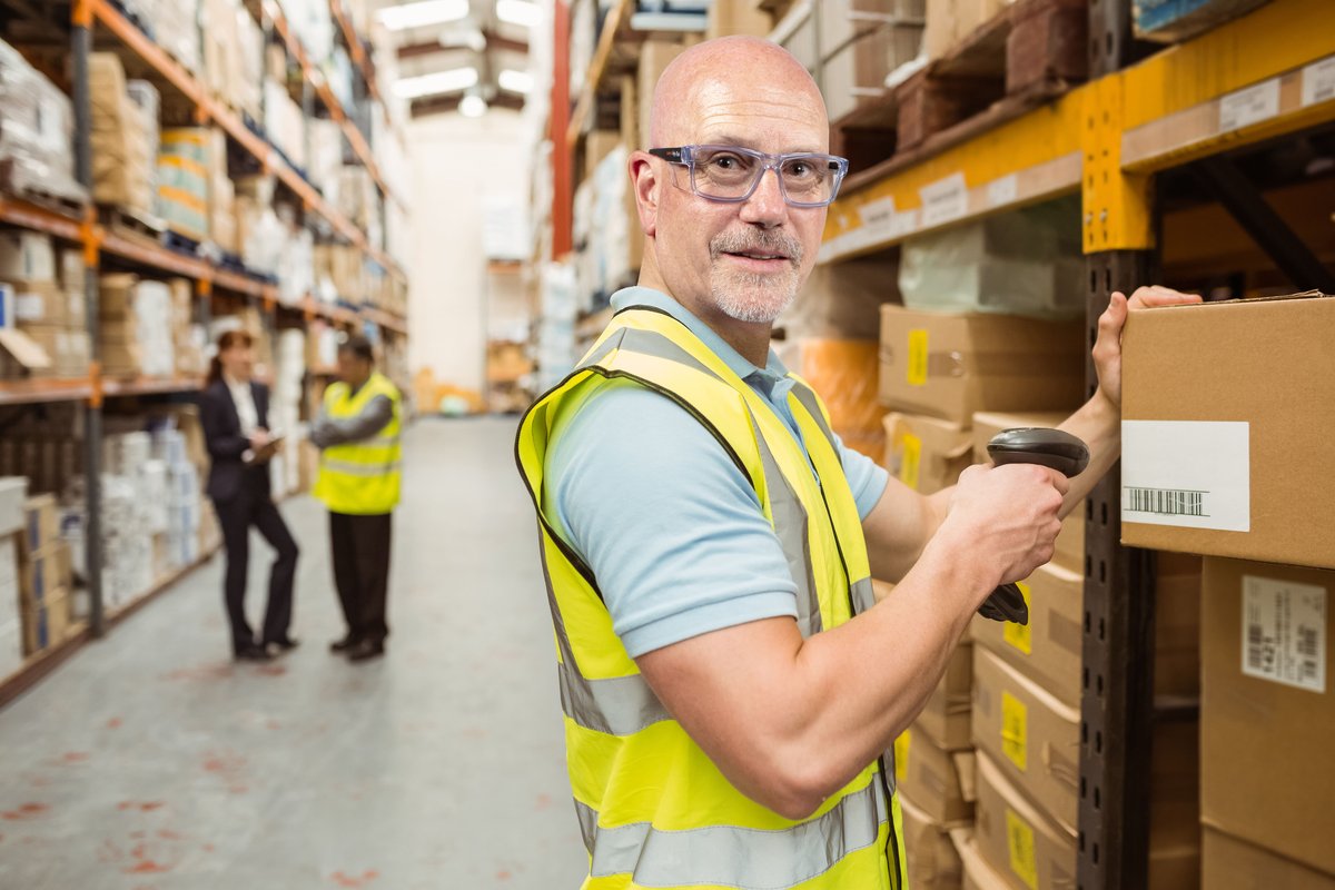 Food production worker wearing protective ugly fish jackal prescription safety glasses